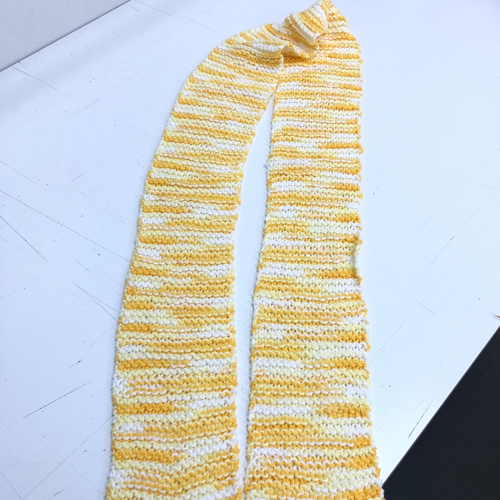 Yellow and white hand knitted scarf